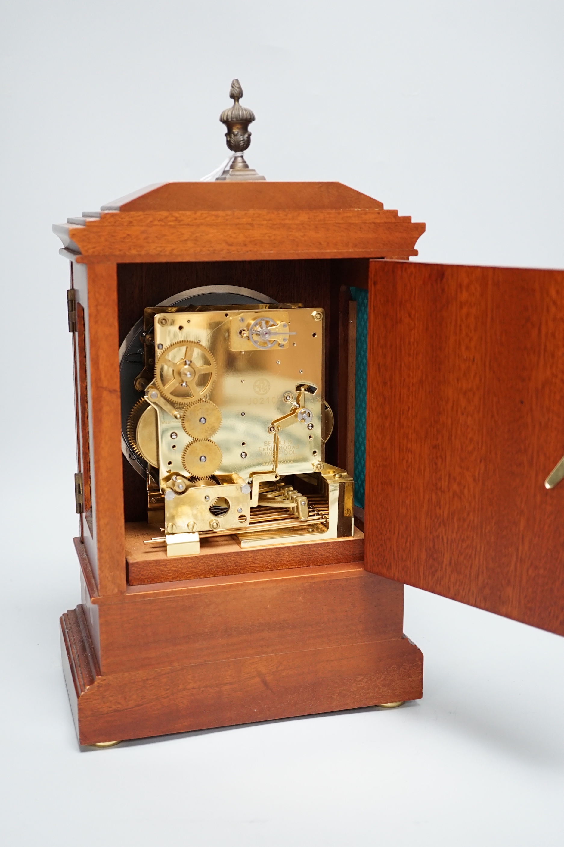 Sewills, Liverpool. An inlaid mantel clock with three train balance escapement movement, chiming on eight gongs, 37cm high